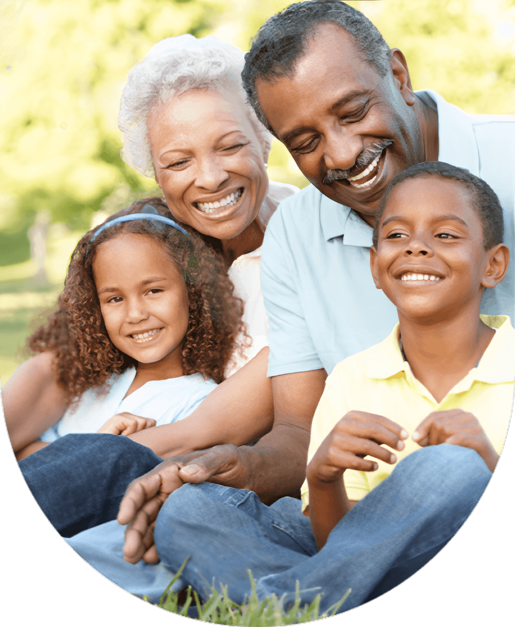 Smiling family sitting together outdoors, enjoying.