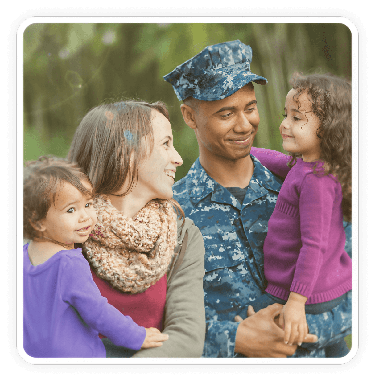 Family reunion with man in military uniform.